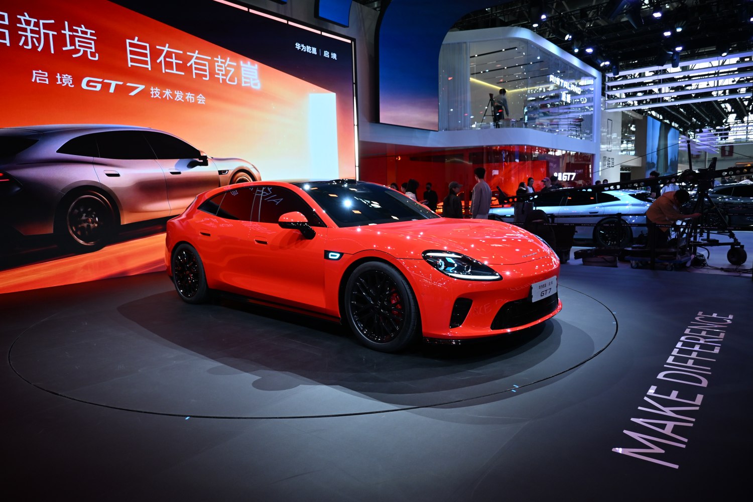 Red sports sedan with sleek design and black alloy wheels