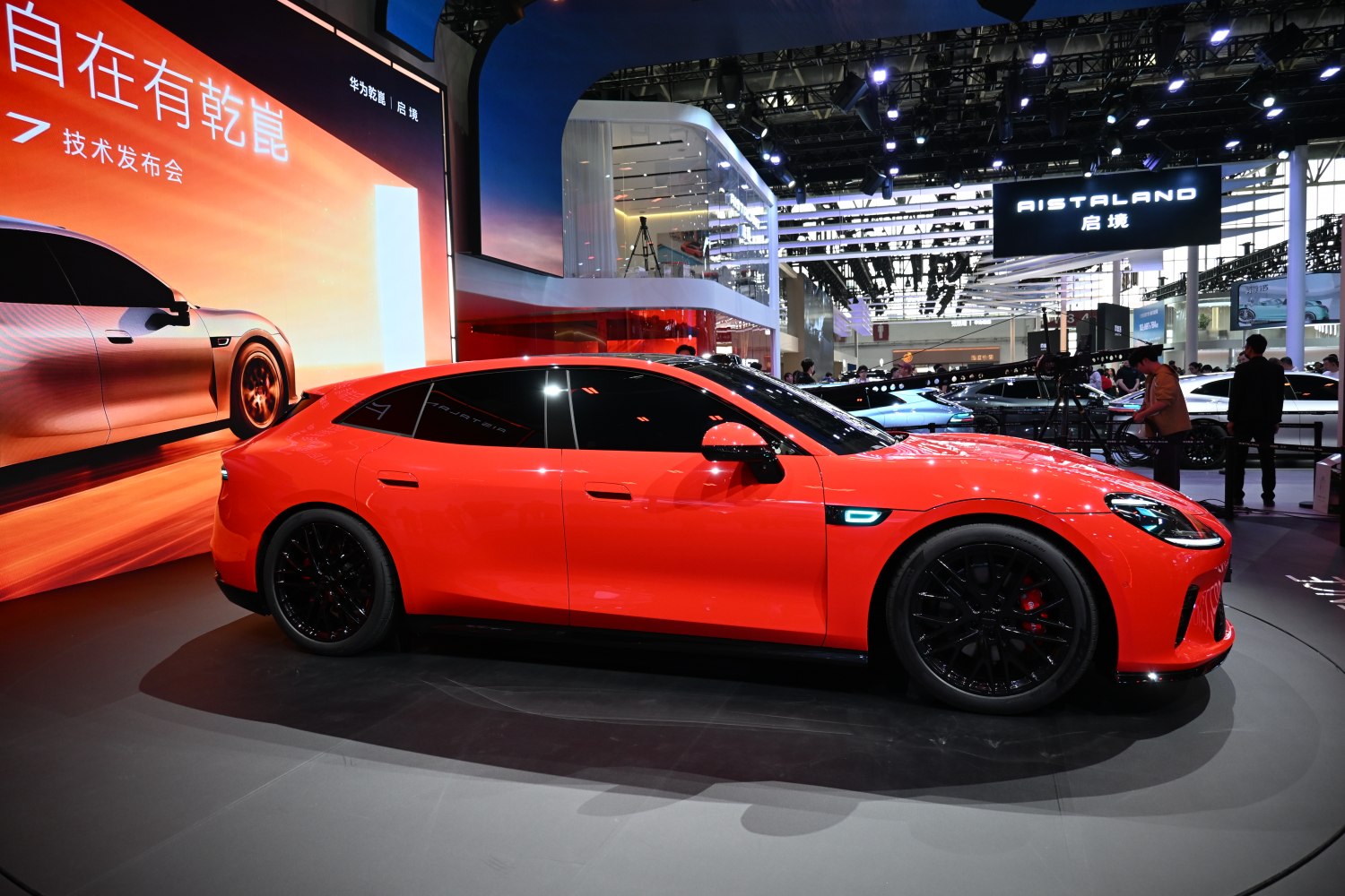 Sleek red sports coupe with black multi-spoke wheels