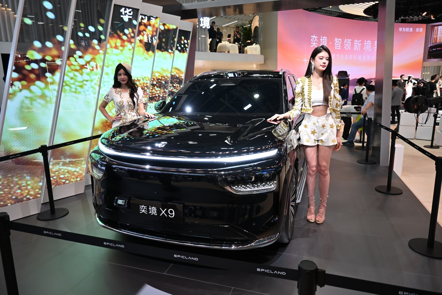 Front view of a black SUV with LED light bar and modern grille design