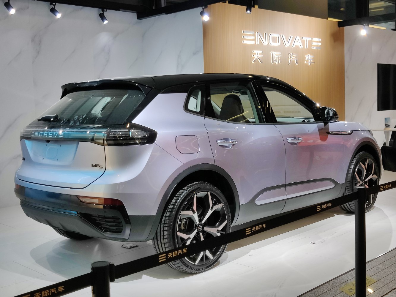 Rear and side view of an electric SUV with sleek design and taillights