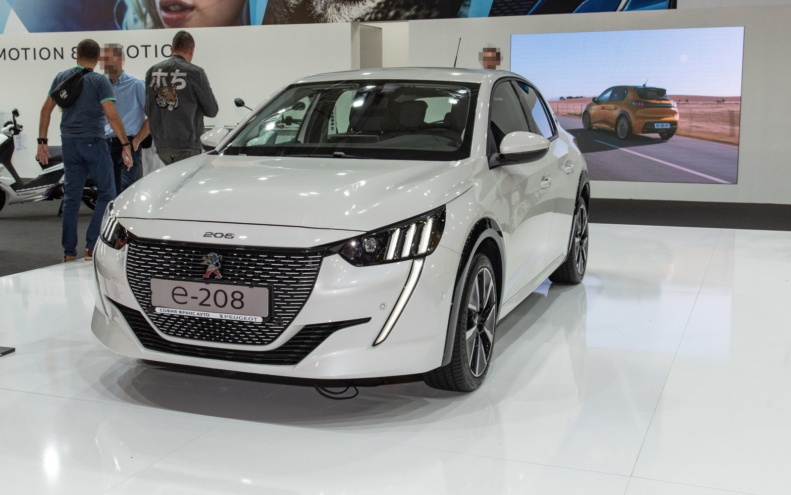 Front view with distinctive LED headlights and grille