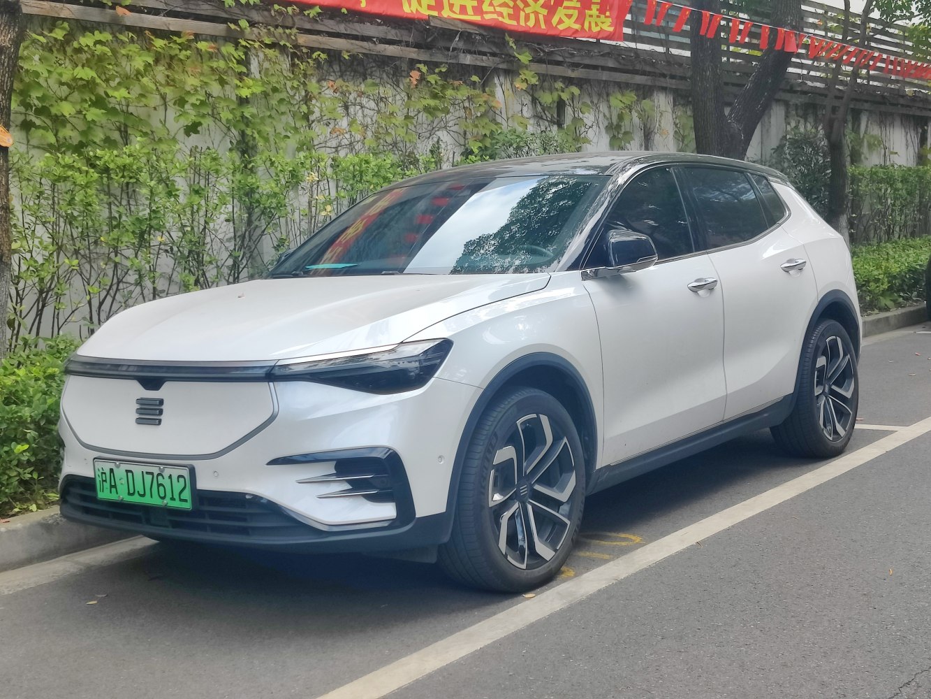 Electric SUV with sleek front, modern headlights, and alloy wheels