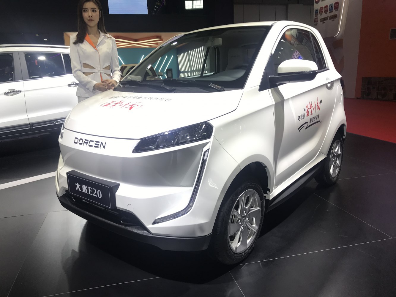 Compact electric vehicle front and side view with sleek headlights