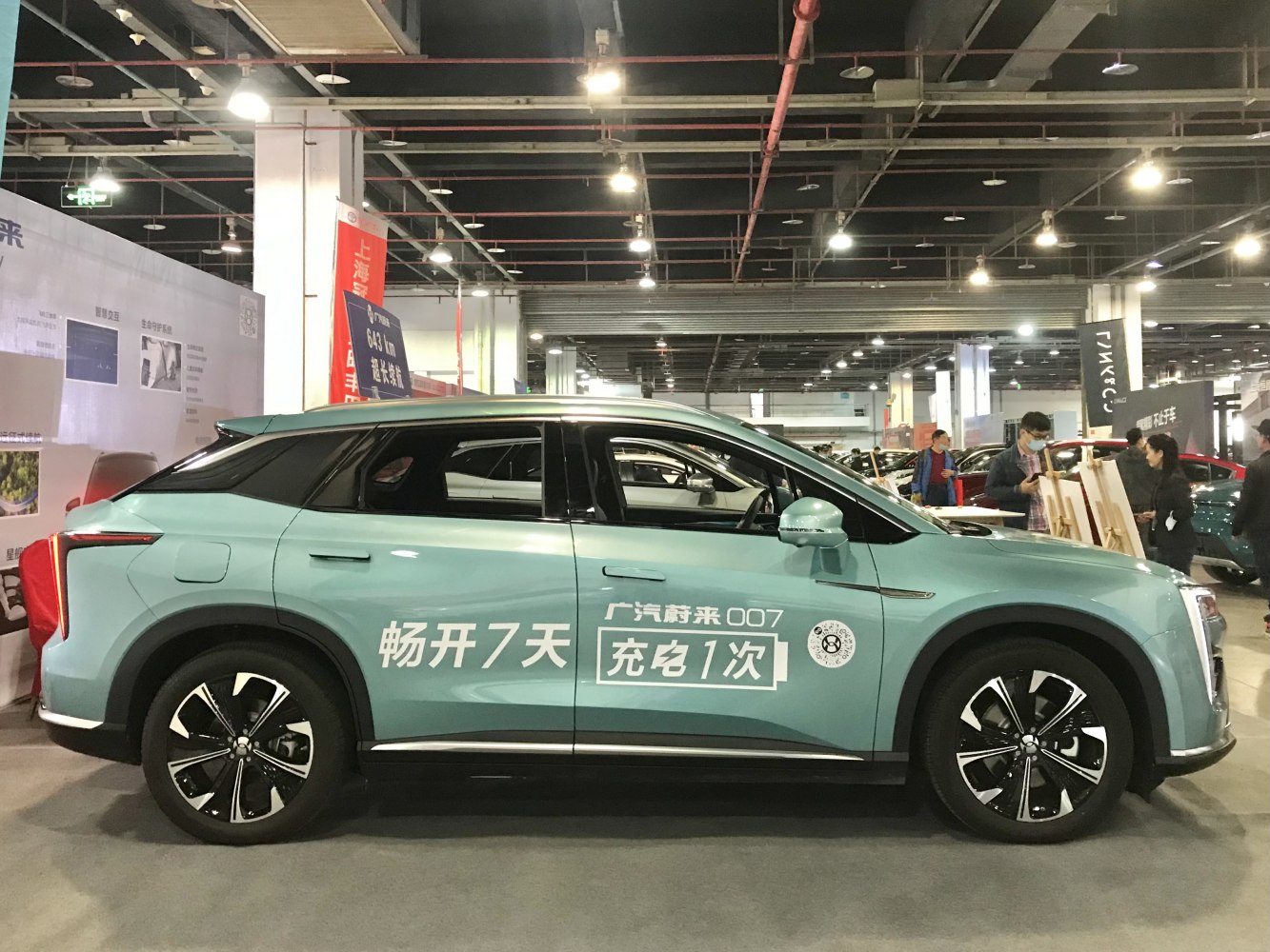 Side profile of electric SUV with modern alloy wheels and aerodynamic design