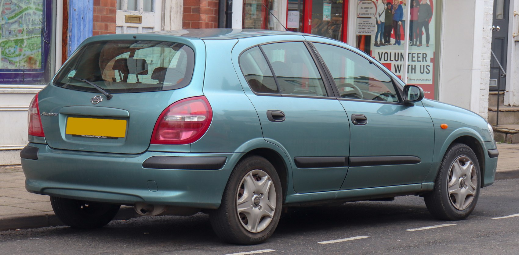 Rear side view of a five-door hatchback with distinctive taillights