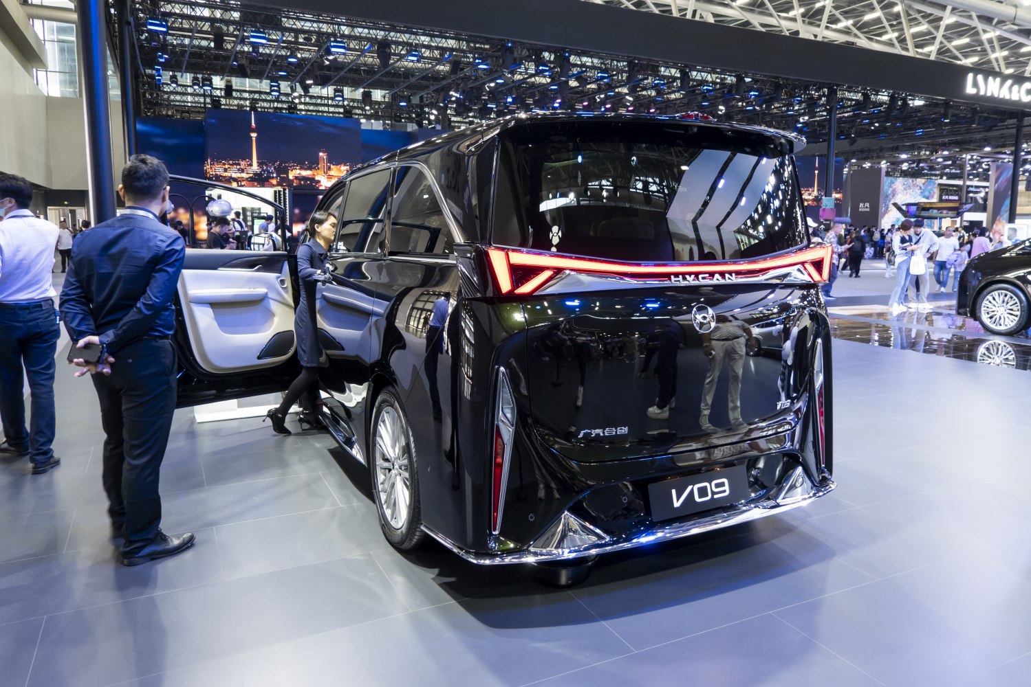 Rear view of modern vehicle with sleek LED tail light strip and wide rear window