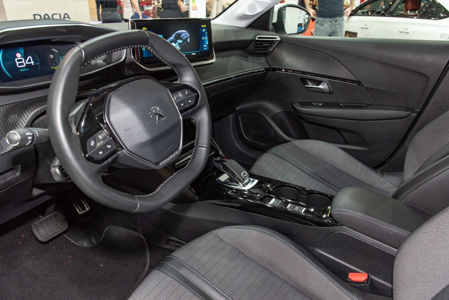 Dashboard, steering wheel, infotainment screen, and central console interior features