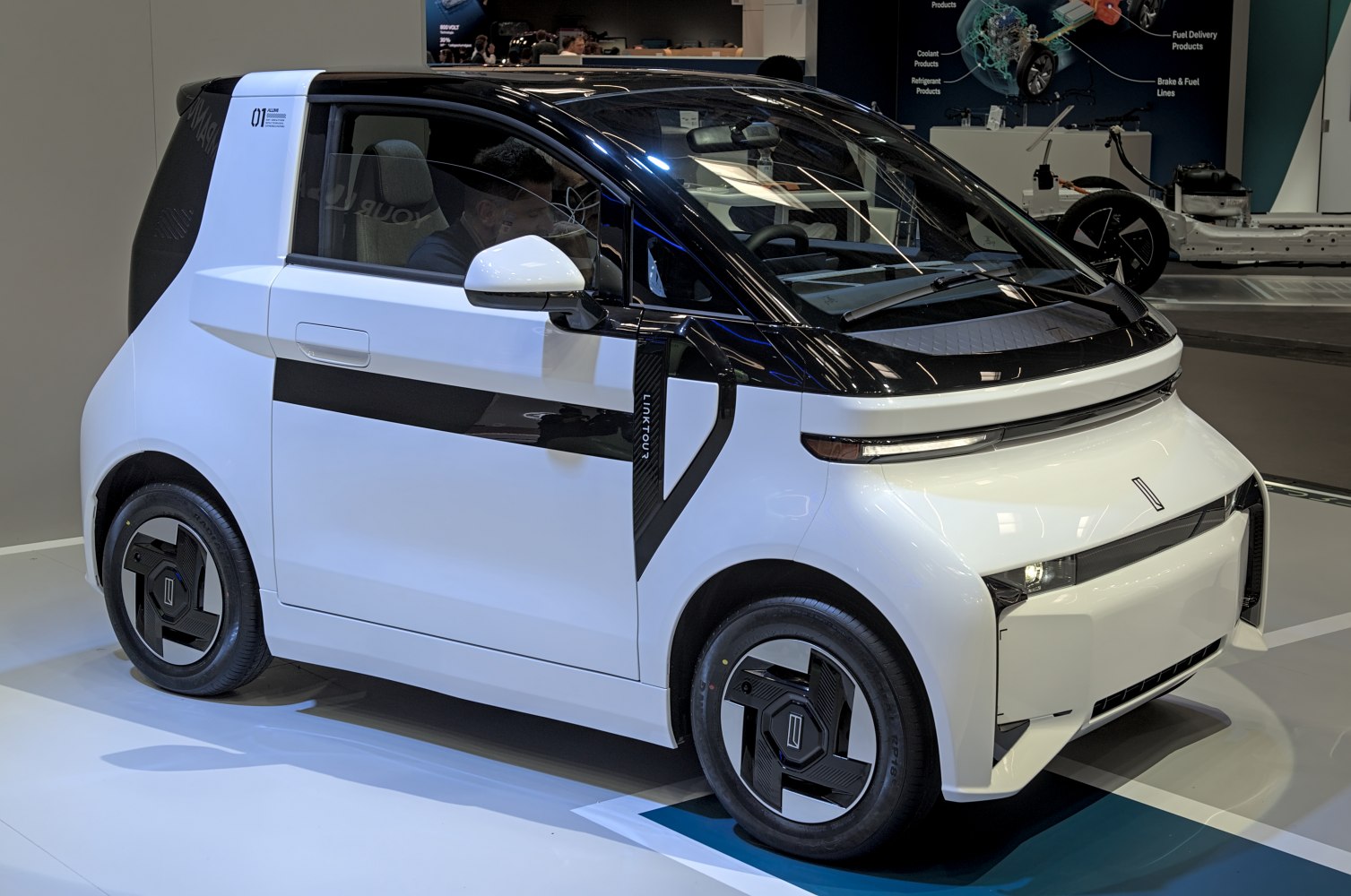 Compact electric microcar with modern sleek design and urban focus