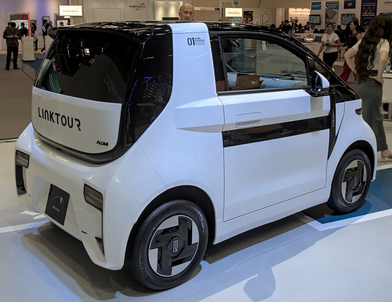Compact electric microcar rear side view with futuristic design
