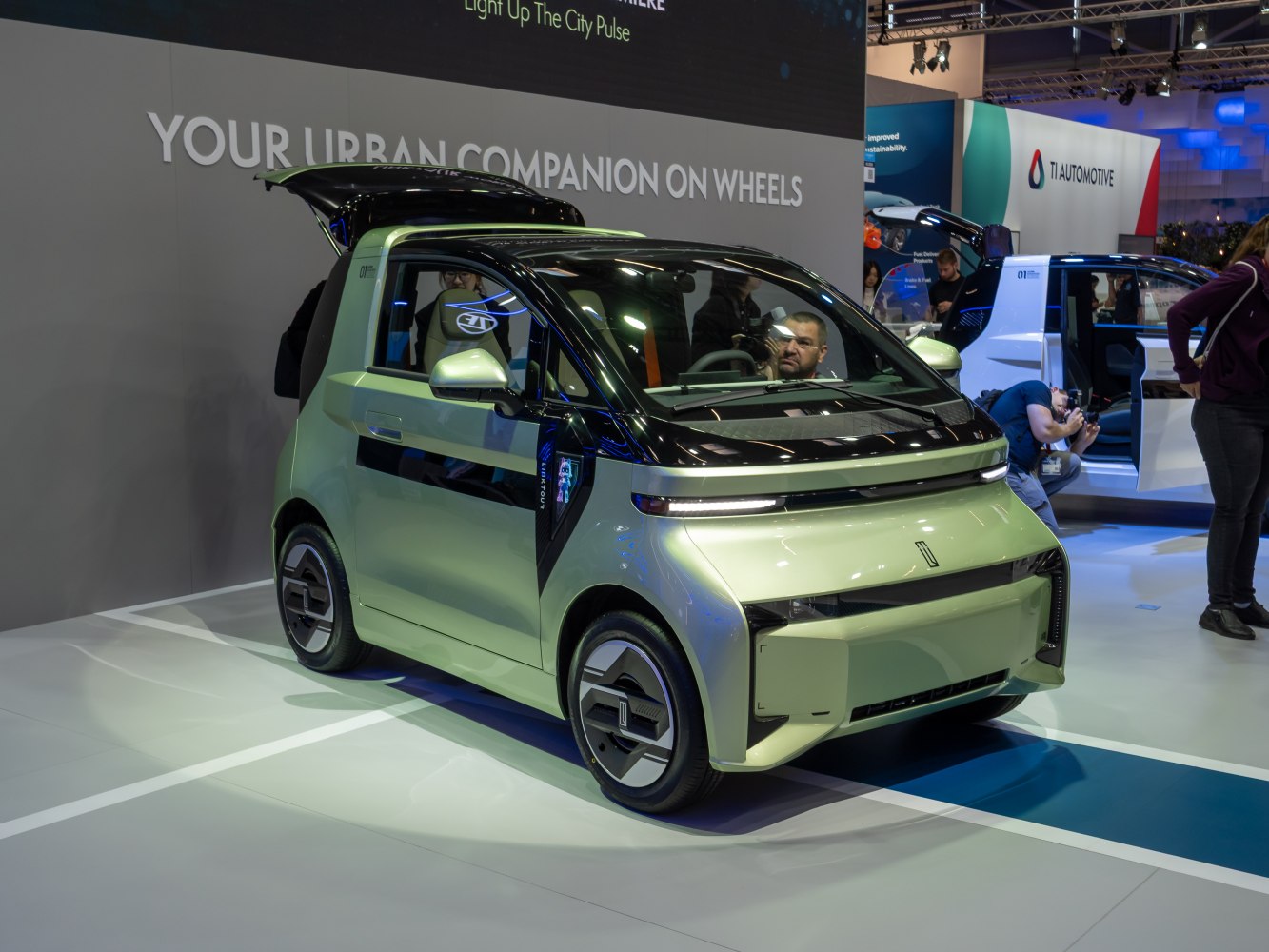 Compact electric microcar with gullwing door and aerodynamic shape