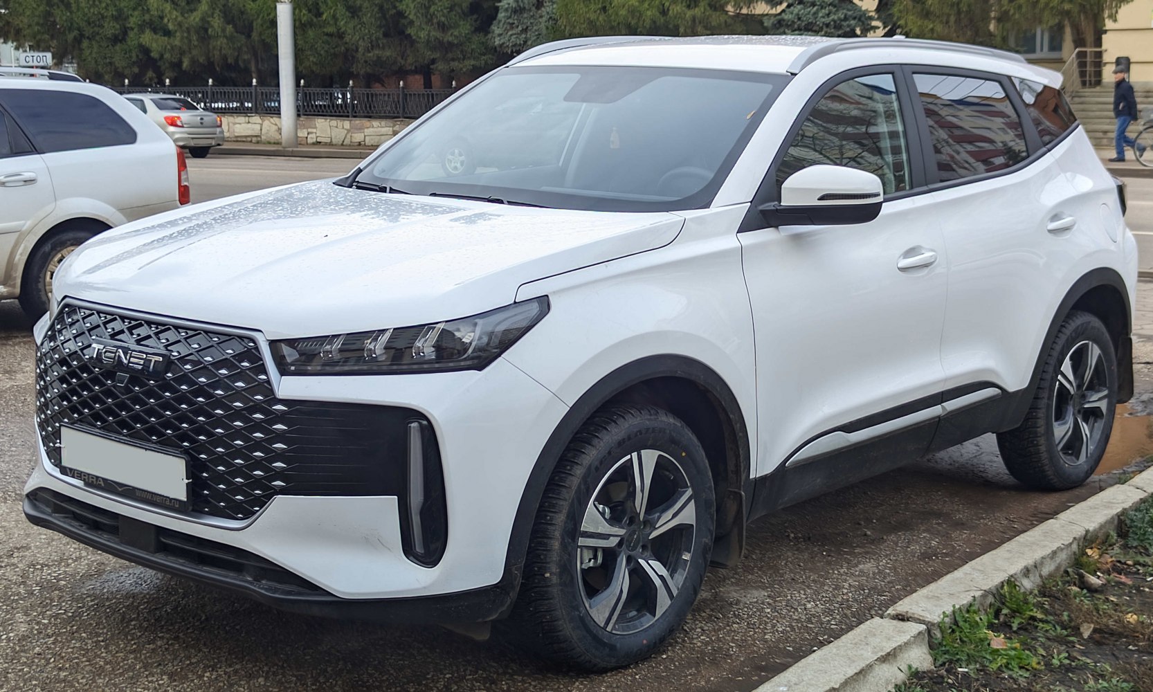 White SUV with diamond-pattern grille and LED headlights