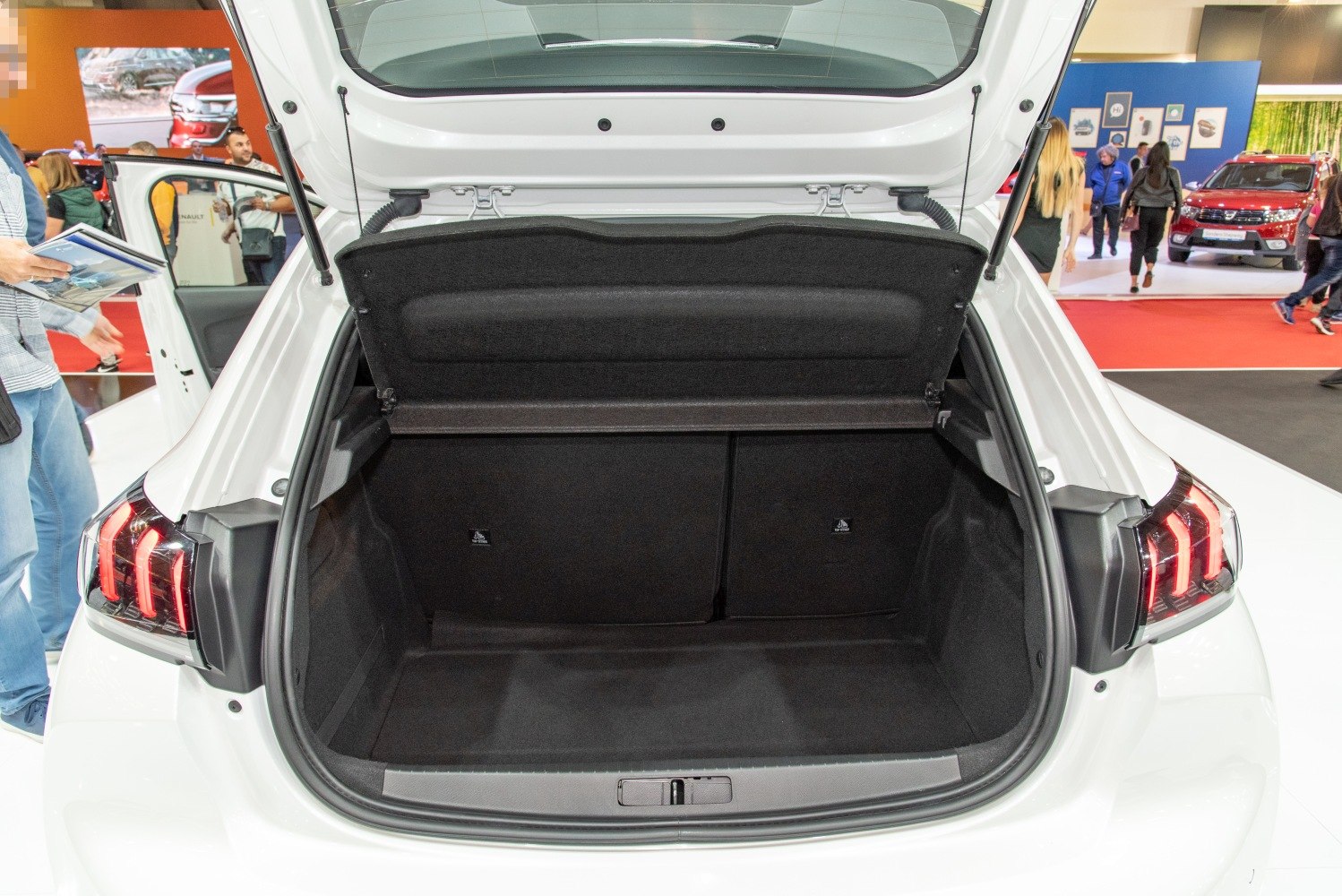 Open rear trunk interior of a hatchback with spacious cargo area.