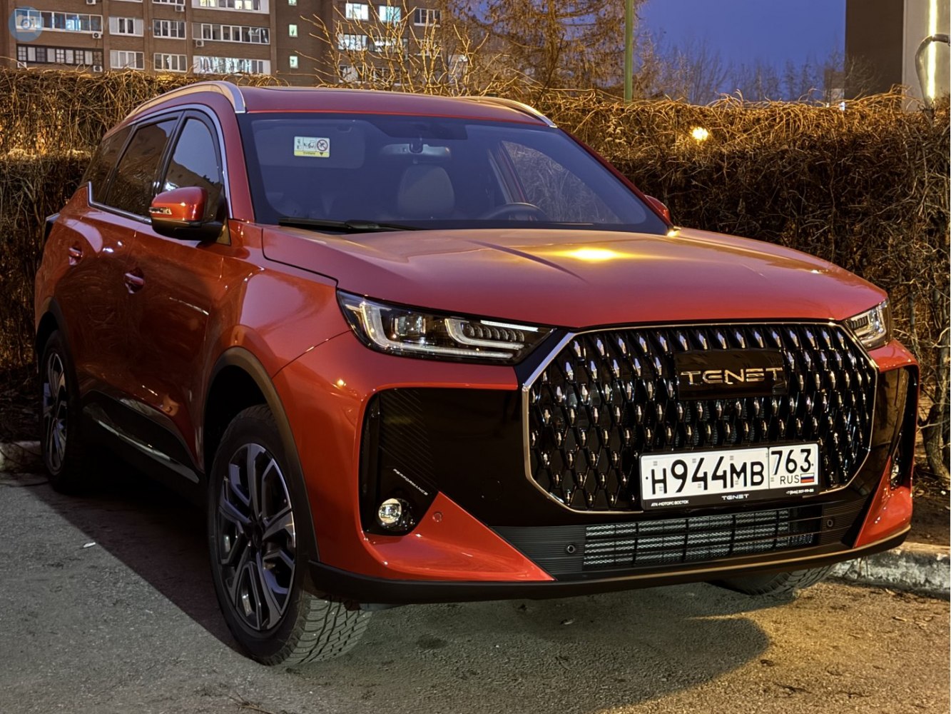 Modern SUV front with large black grille and sleek LED headlights