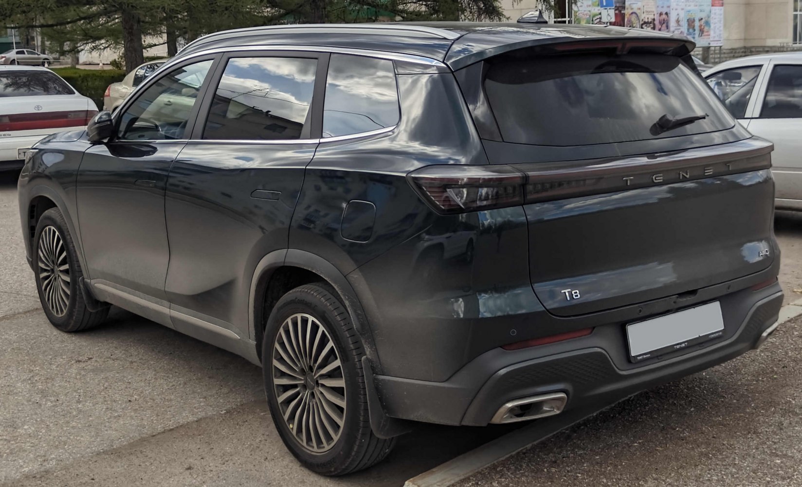 Rear view of an SUV with sleek taillights and dual exhaust integration