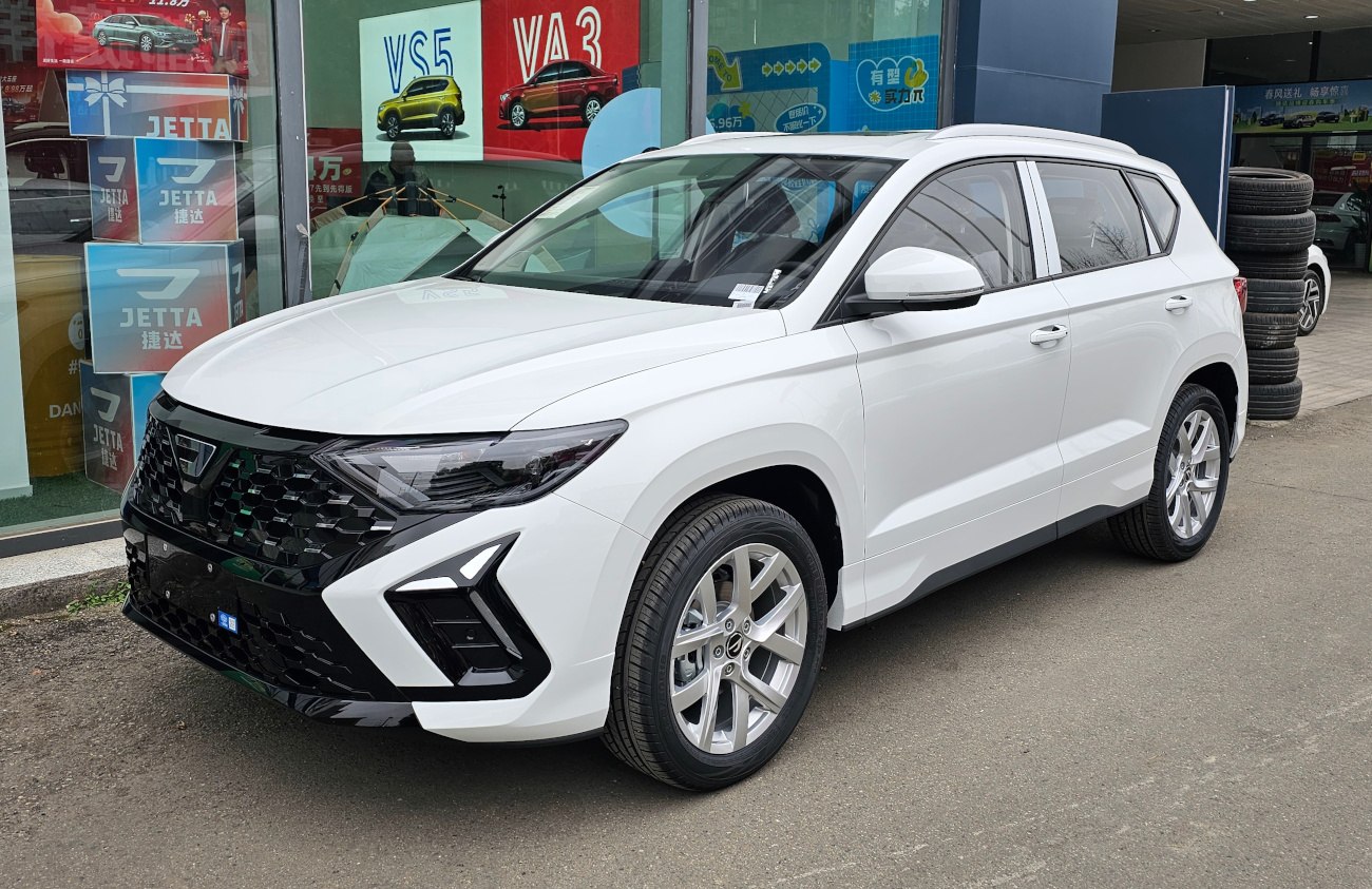 White compact SUV with black honeycomb grille and angular LED headlights