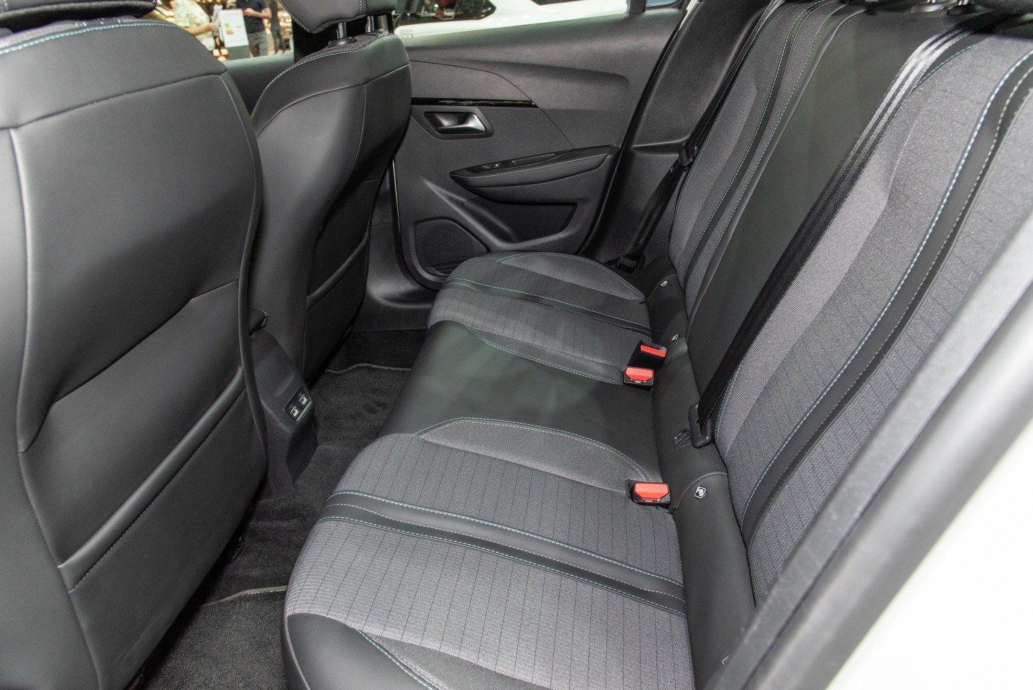 Fabric and leather rear seats with seat belts and door panel