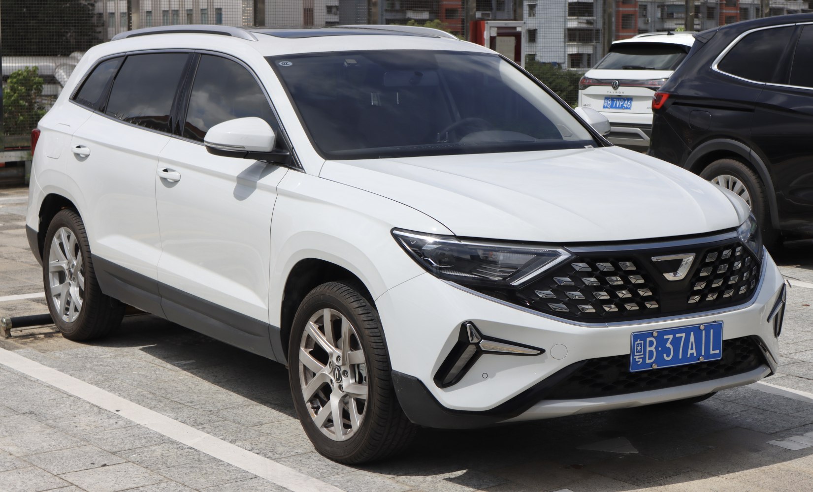 Compact SUV with angular LED headlights and bold grille design