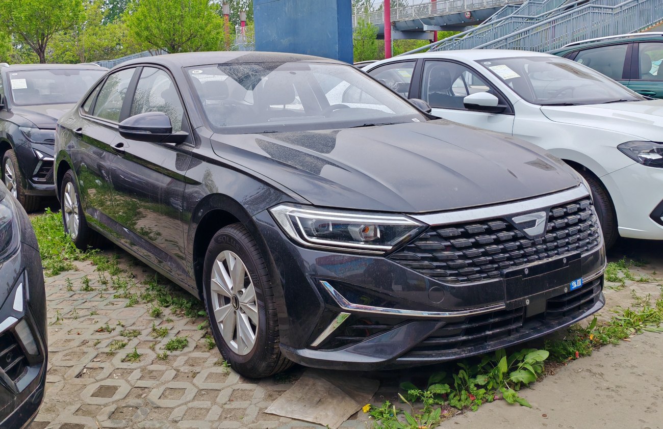 Sleek sedan front with LED headlights and distinctive grille design