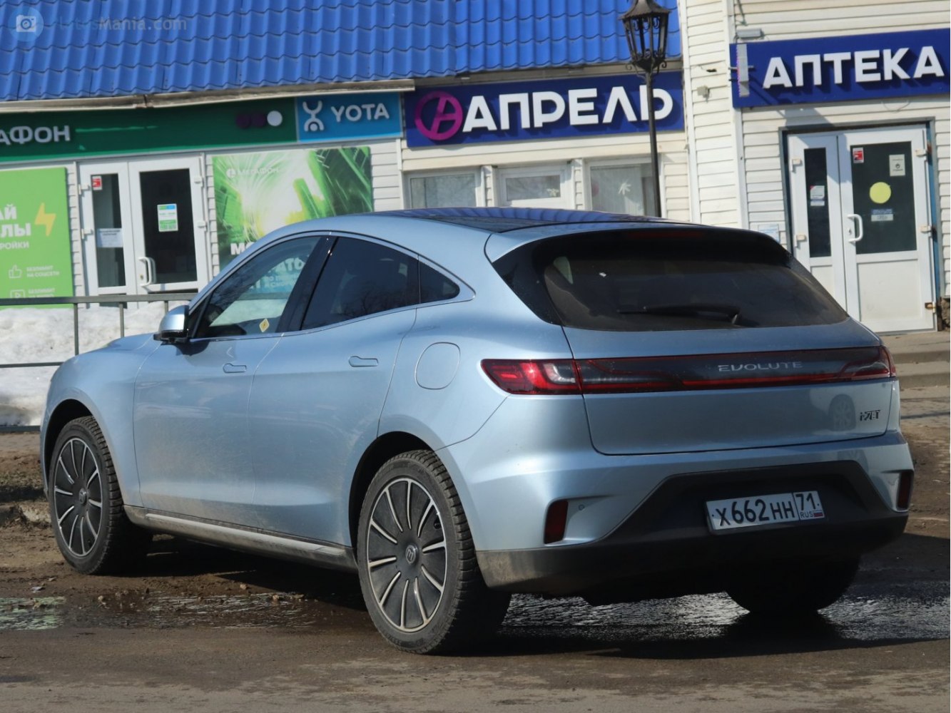 Rear-side profile of a modern hatchback with continuous rear light bar