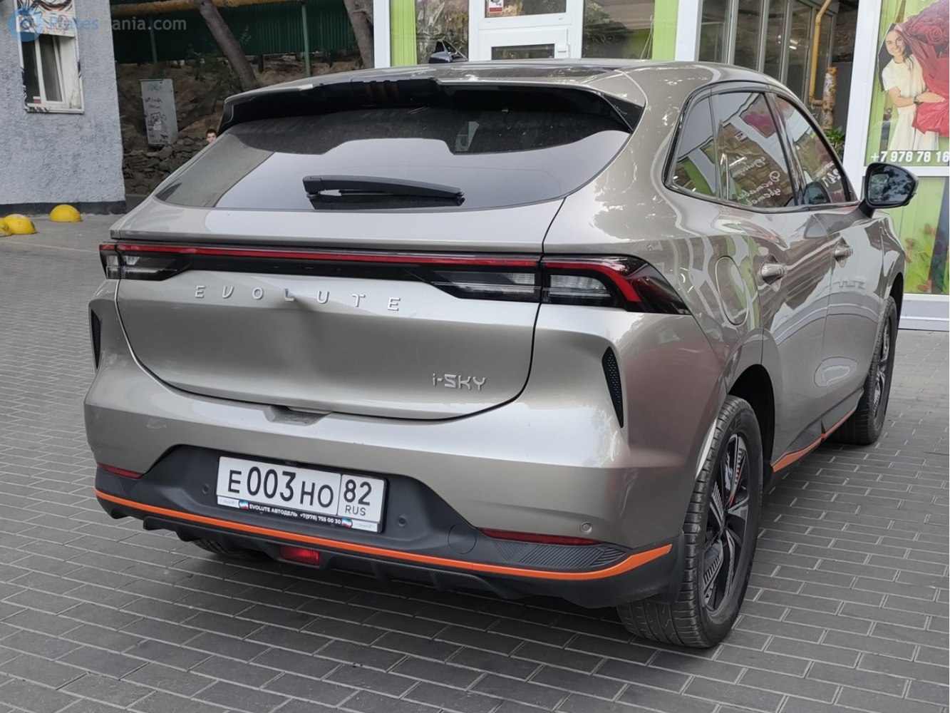 Rear view of electric SUV with LED taillights and sporty rear bumper