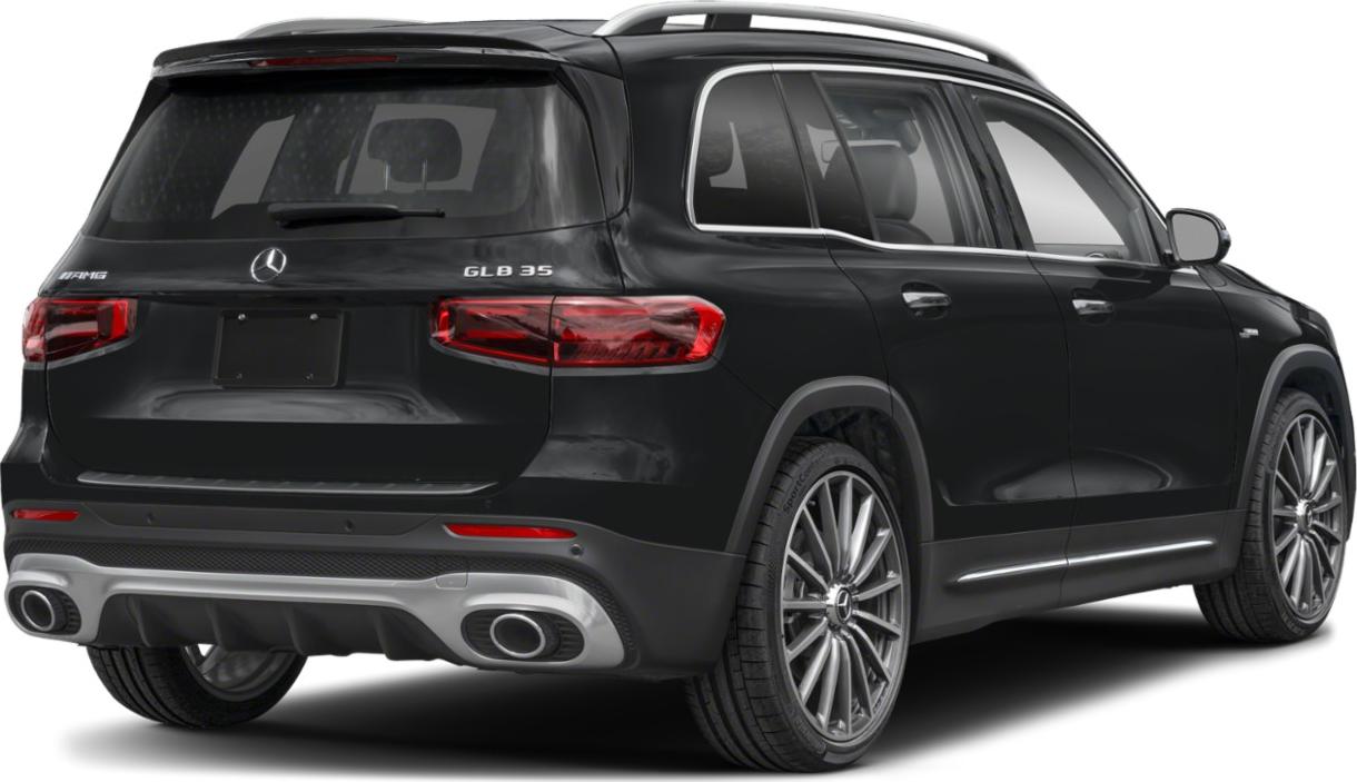 Rear view with AMG badge, dual exhaust, sleek taillights, large wheels