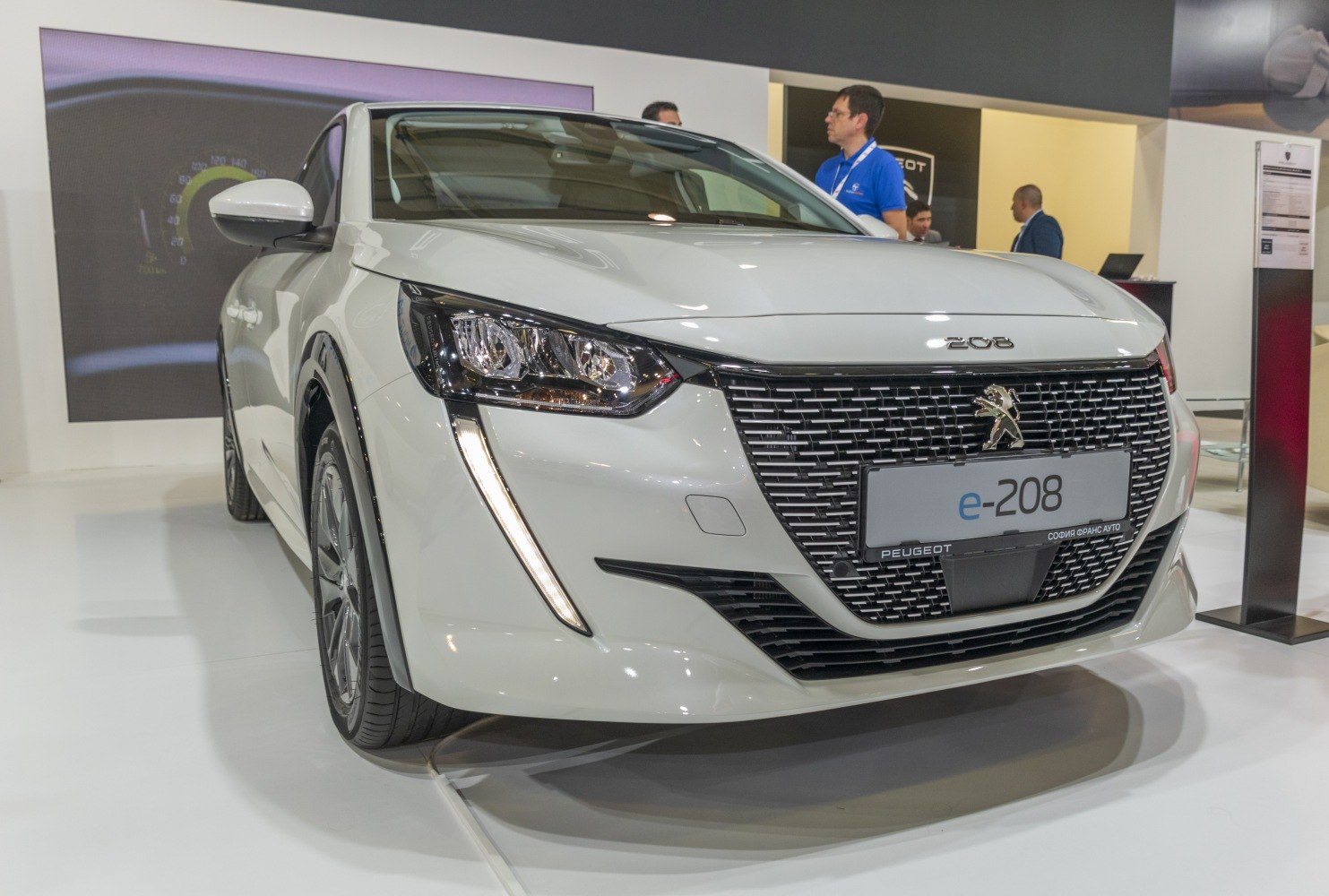 Close-up view of modern front grille and LED headlights