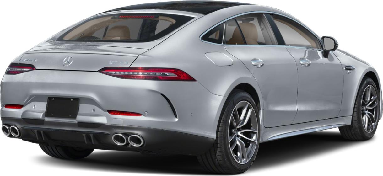 Rear view of a silver 4-door coupe with quad exhausts and sporty design.