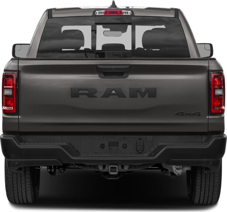 Rear view of pickup tailgate with RAM badge and 4x4 emblem