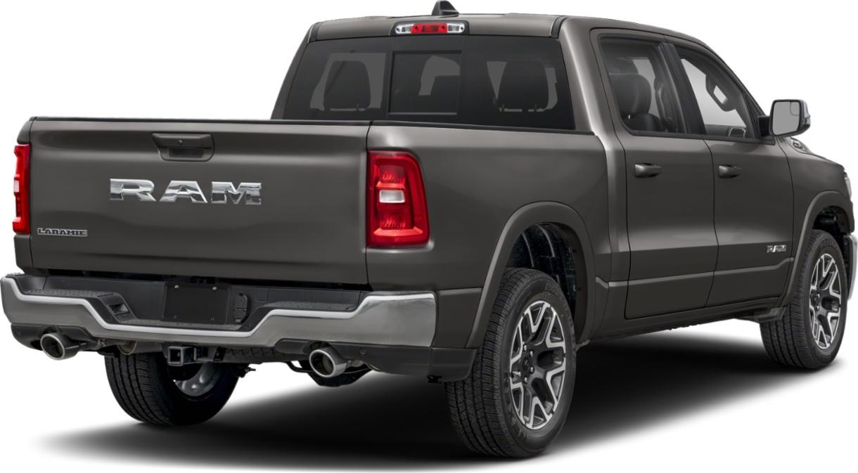 Rear side view of quad cab short pickup with dual exhaust and distinctive taillights
