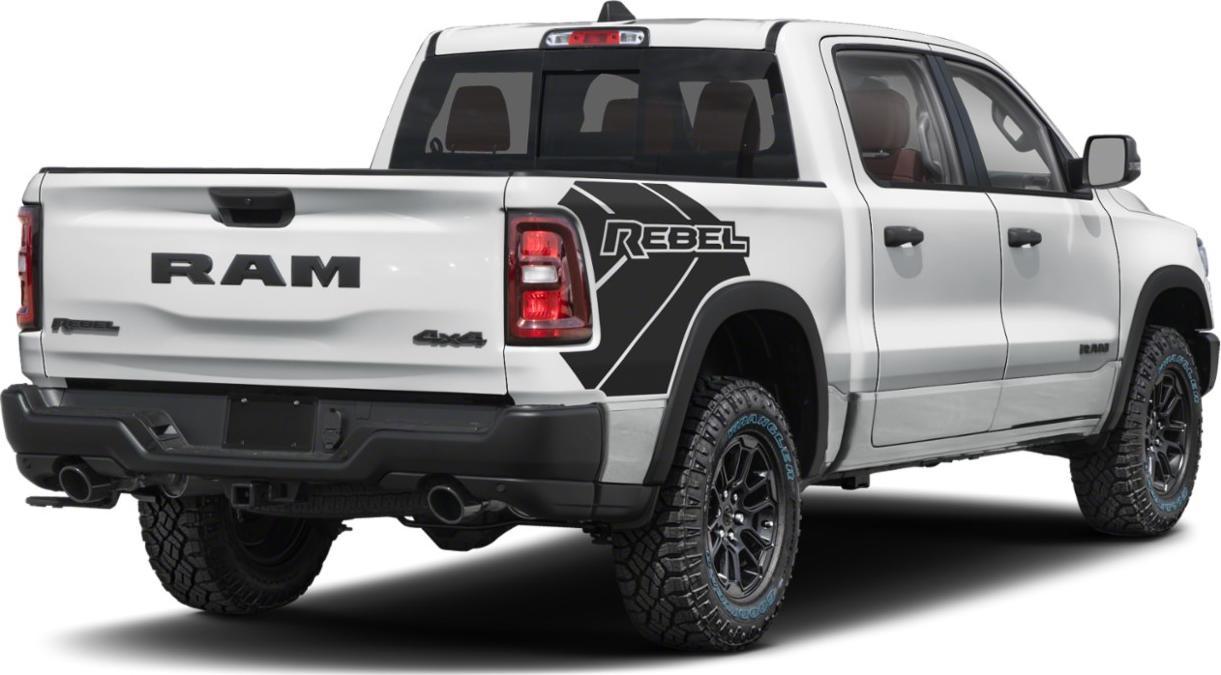 Rear view of pickup with Rebel decal and off-road tires