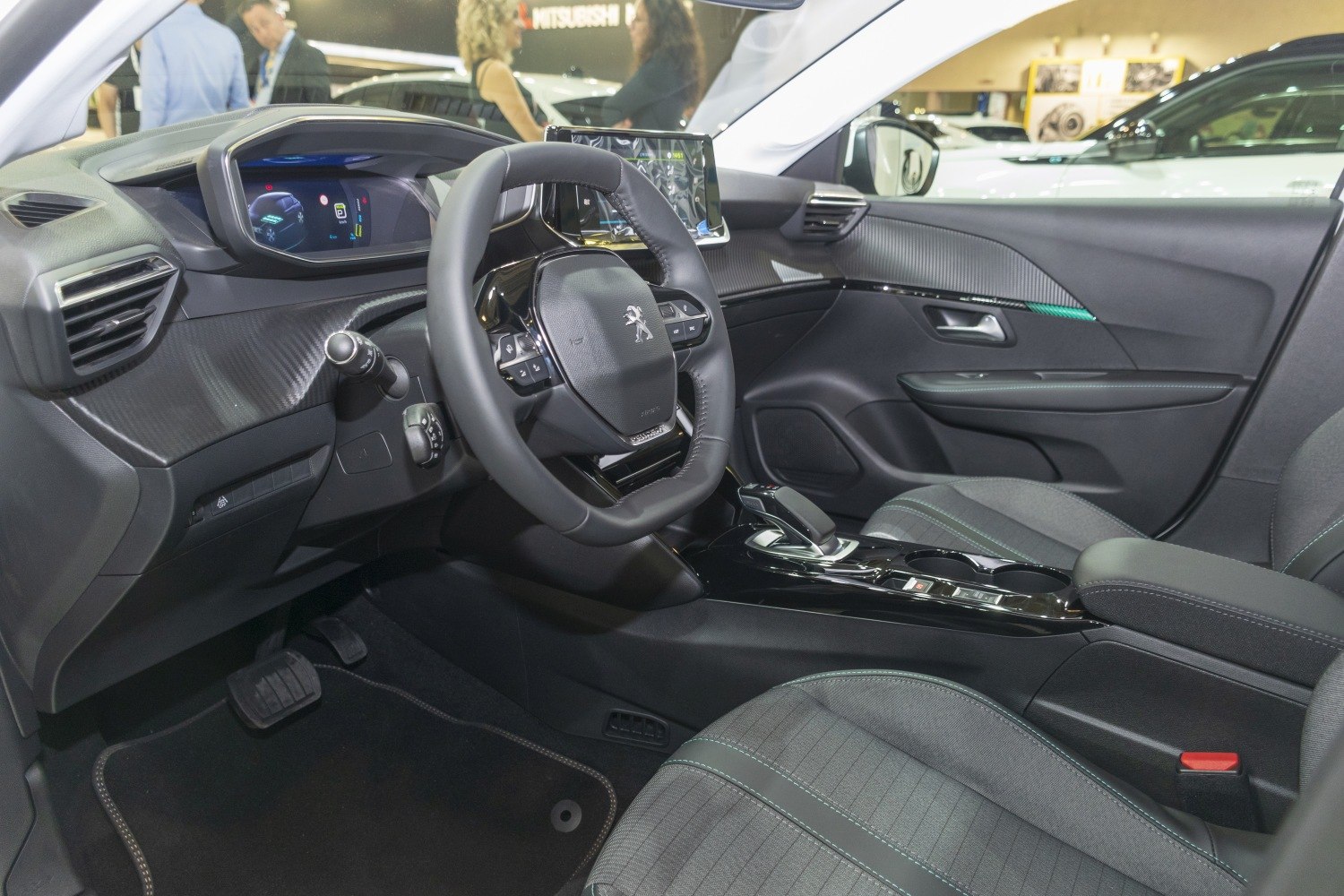 Digital instrument cluster and multifunction steering wheel in car interior