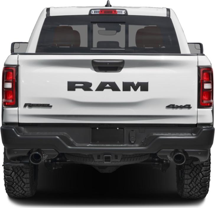Rear view of pickup with Rebel and 4x4 badges, dual exhaust, and rugged tires