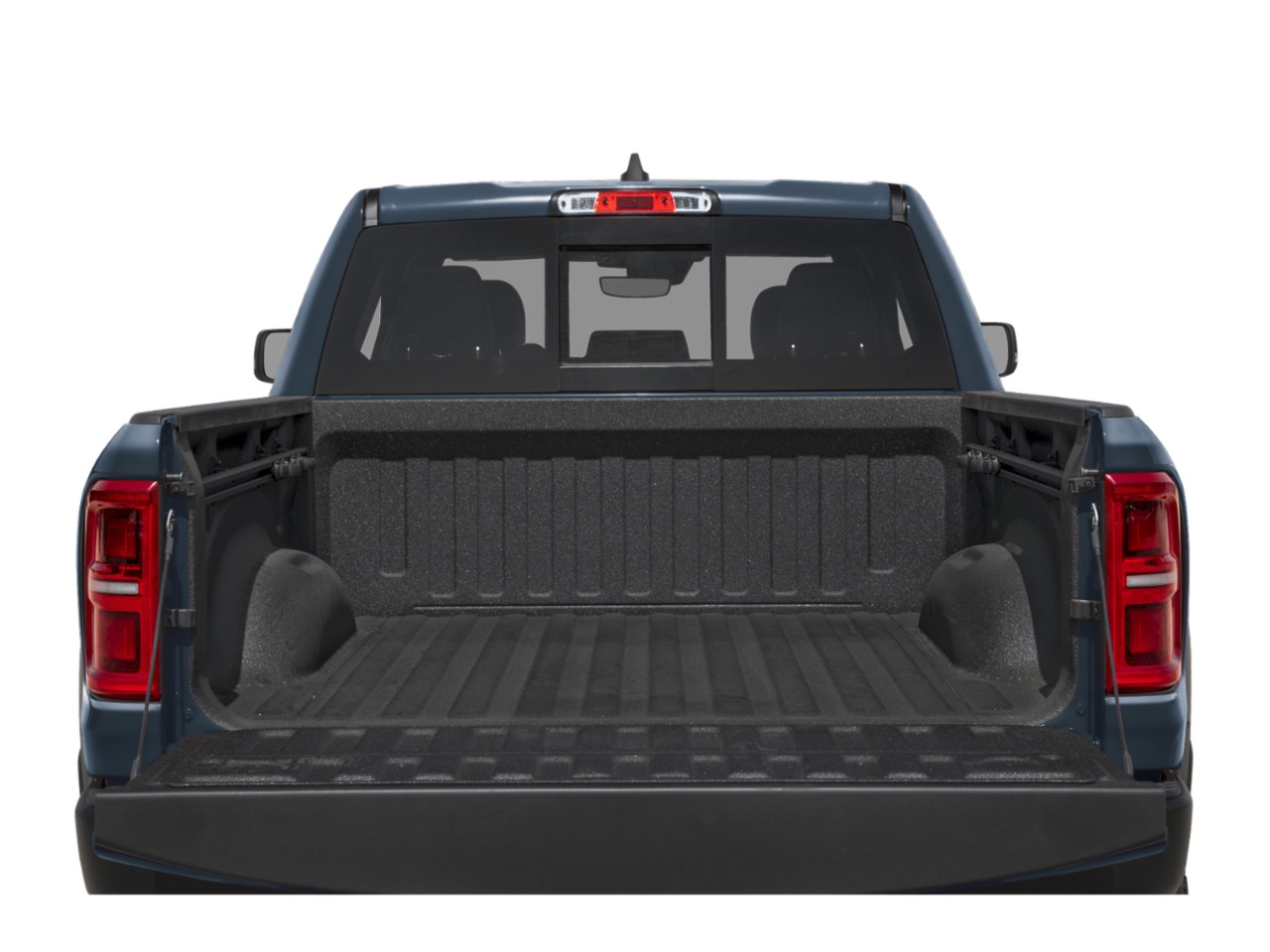 Pickup truck bed with textured liner and lowered tailgate