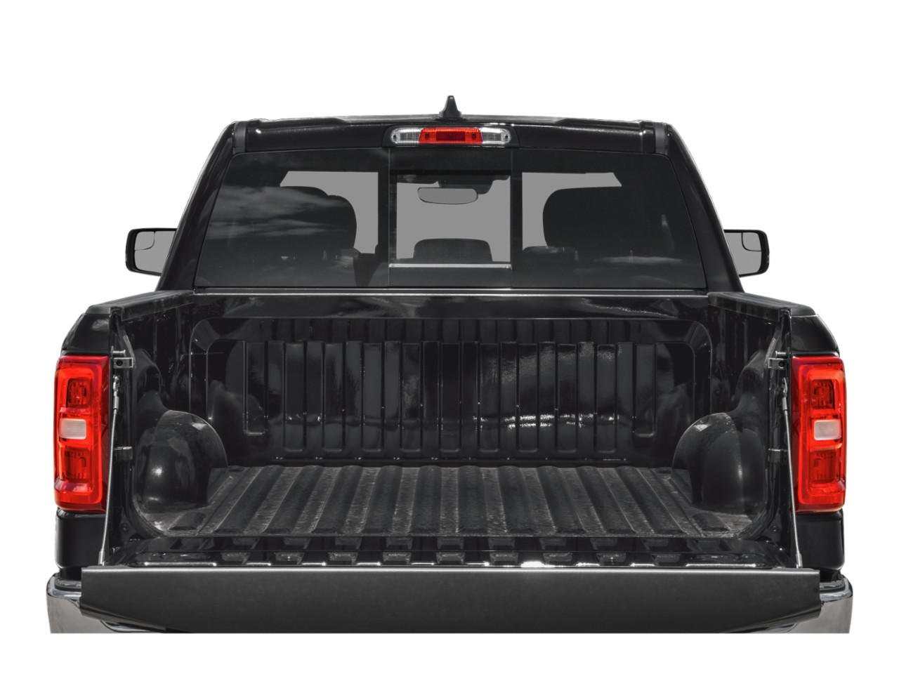 Open black truck bed with ribbed cargo area and tailgate down