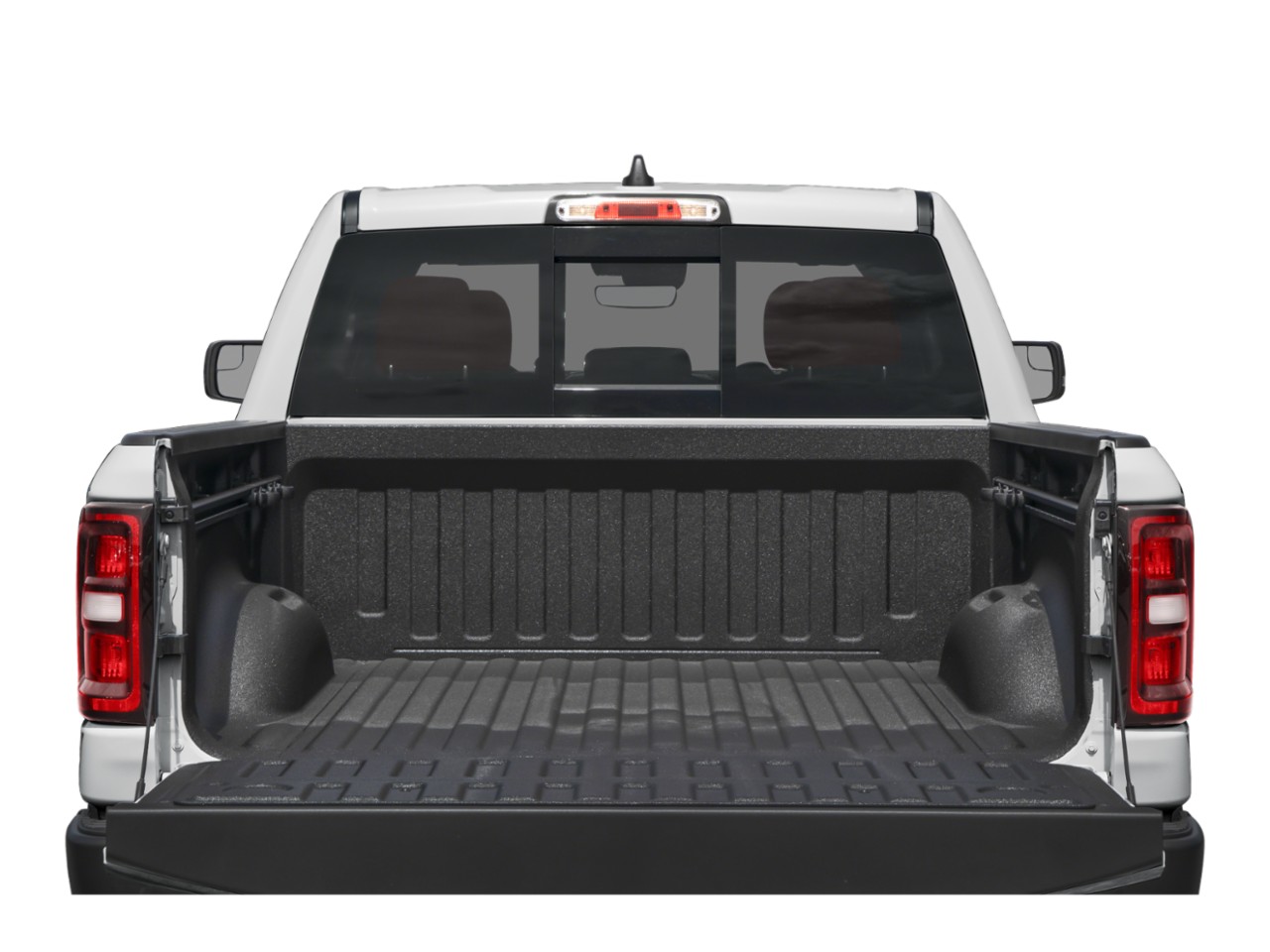 Open tailgate with protective bed liner and rear window of pickup truck