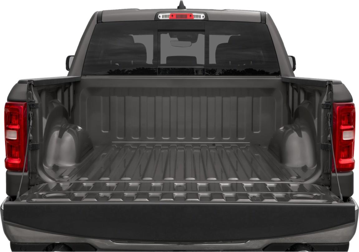 Open truck bed with tailgate and rear lighting.