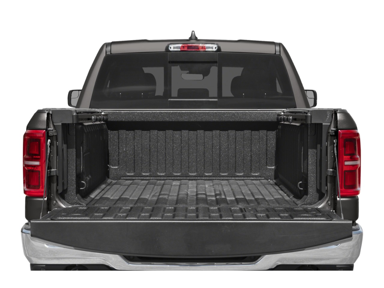 Open truck bed with textured liner and red tail lights