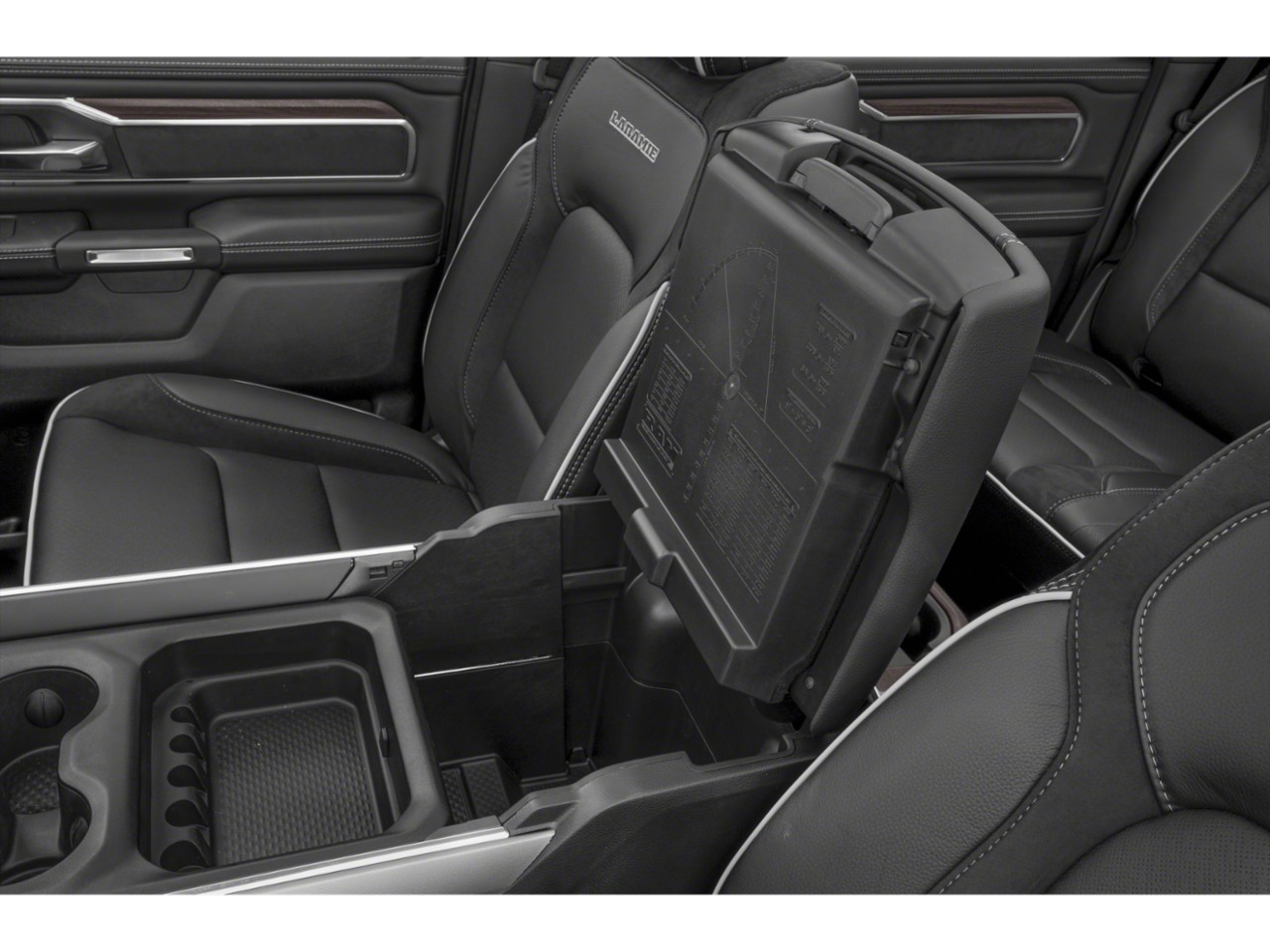 Center console storage compartment and black luxury seating upholstery