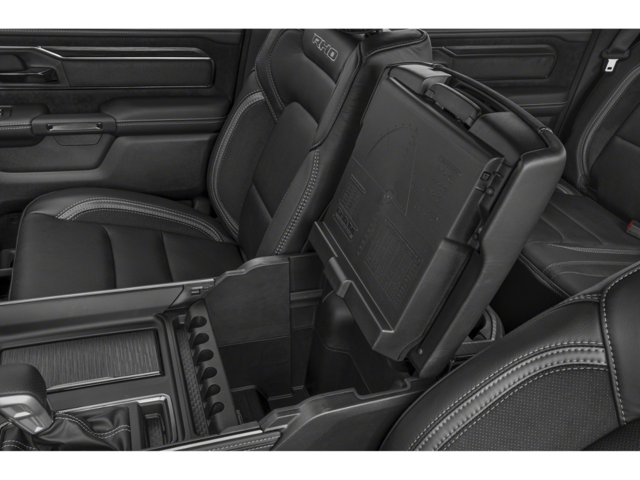 Interior storage compartment with black leather seats and center console.