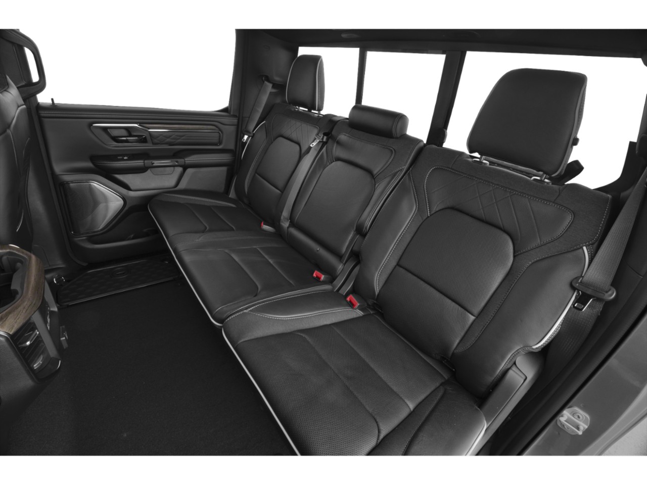 Black leather rear seats with detailed stitching and spacious layout