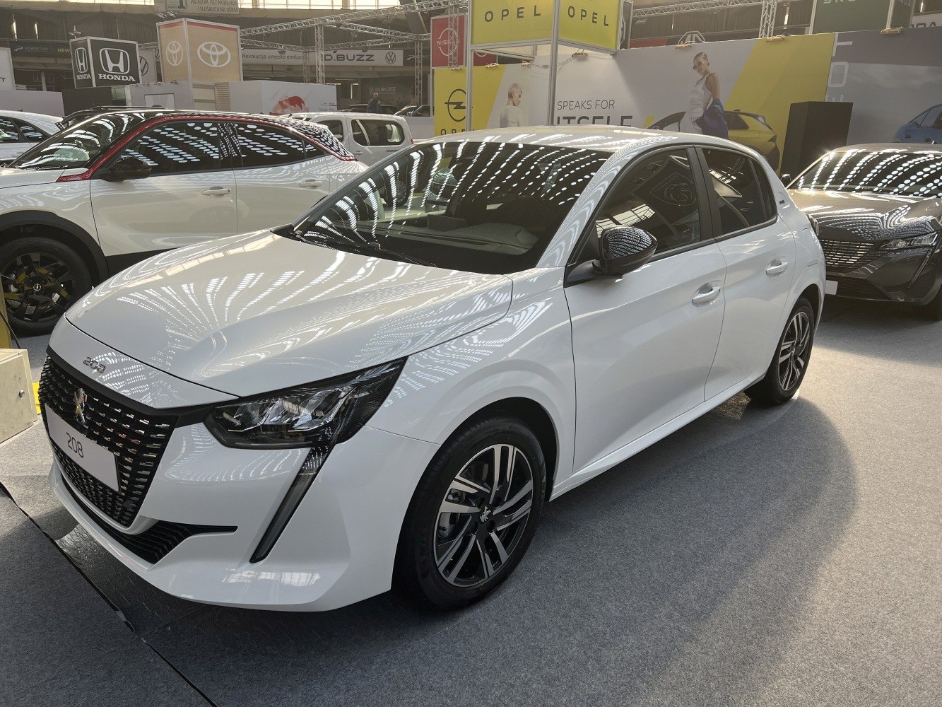White hatchback with sleek front and side exterior design