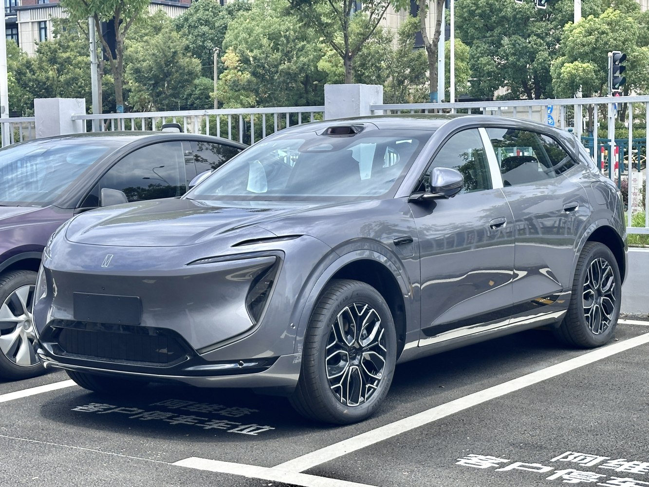 Sharp LED headlights and sporty alloy wheels on SUV front