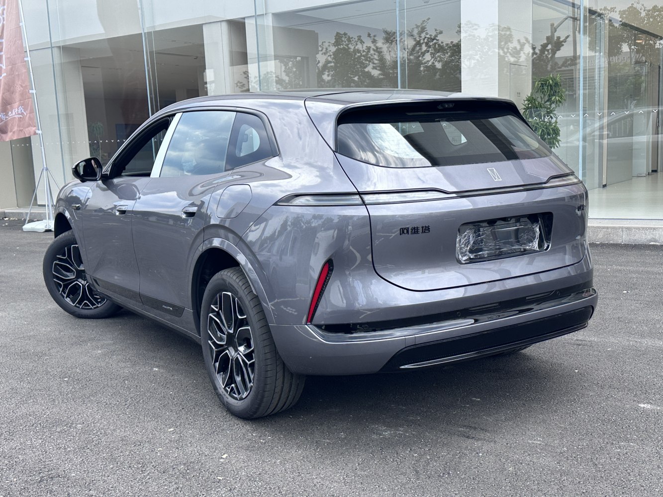 Rear view of a modern SUV with sleek taillights and distinctive alloy wheels