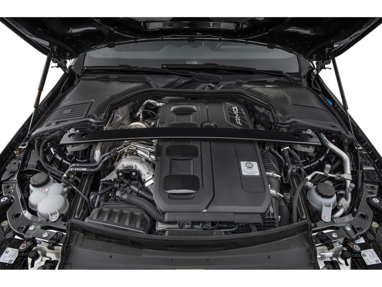 AMG engine bay with turbo components in a luxury sedan