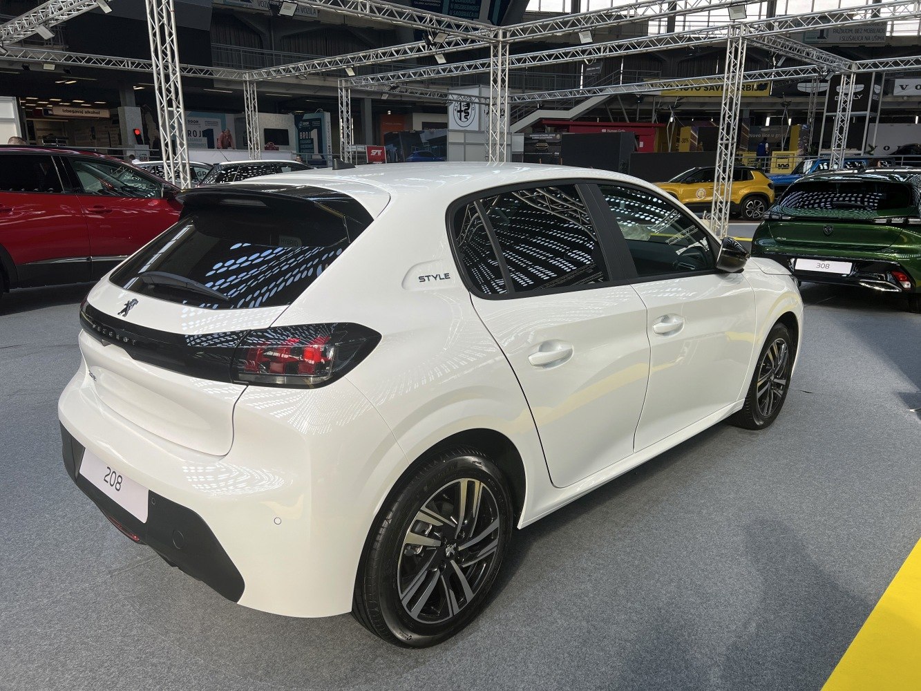 Rear and side view of a modern hatchback with sporty wheels and tinted windows