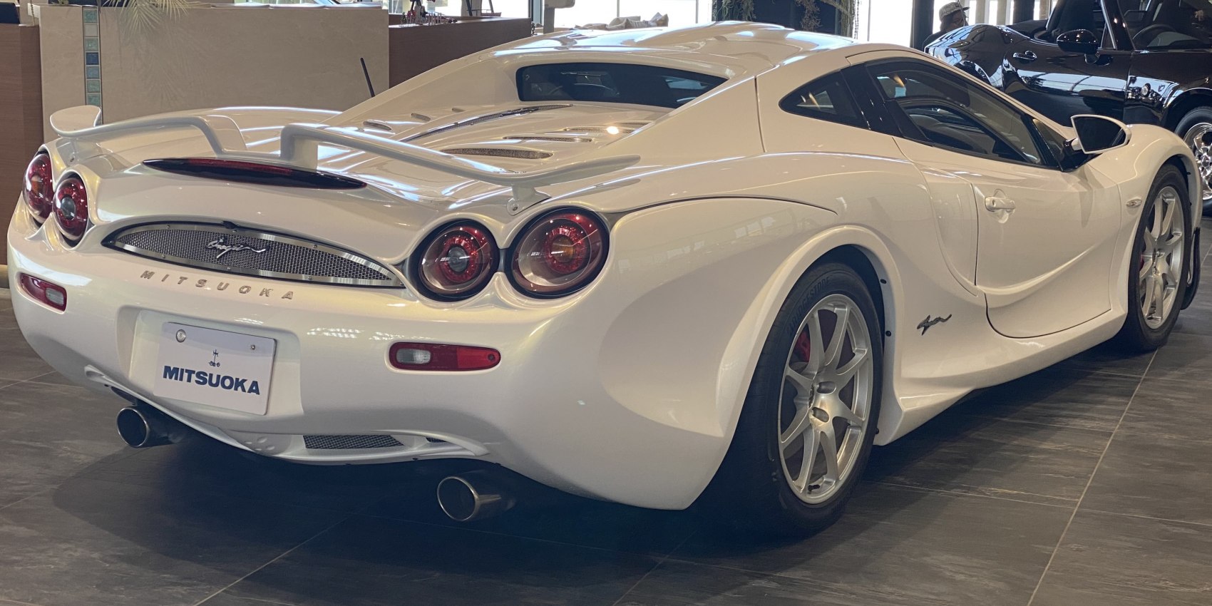 Distinctive rear view with quad round taillights and dual exhaust pipes