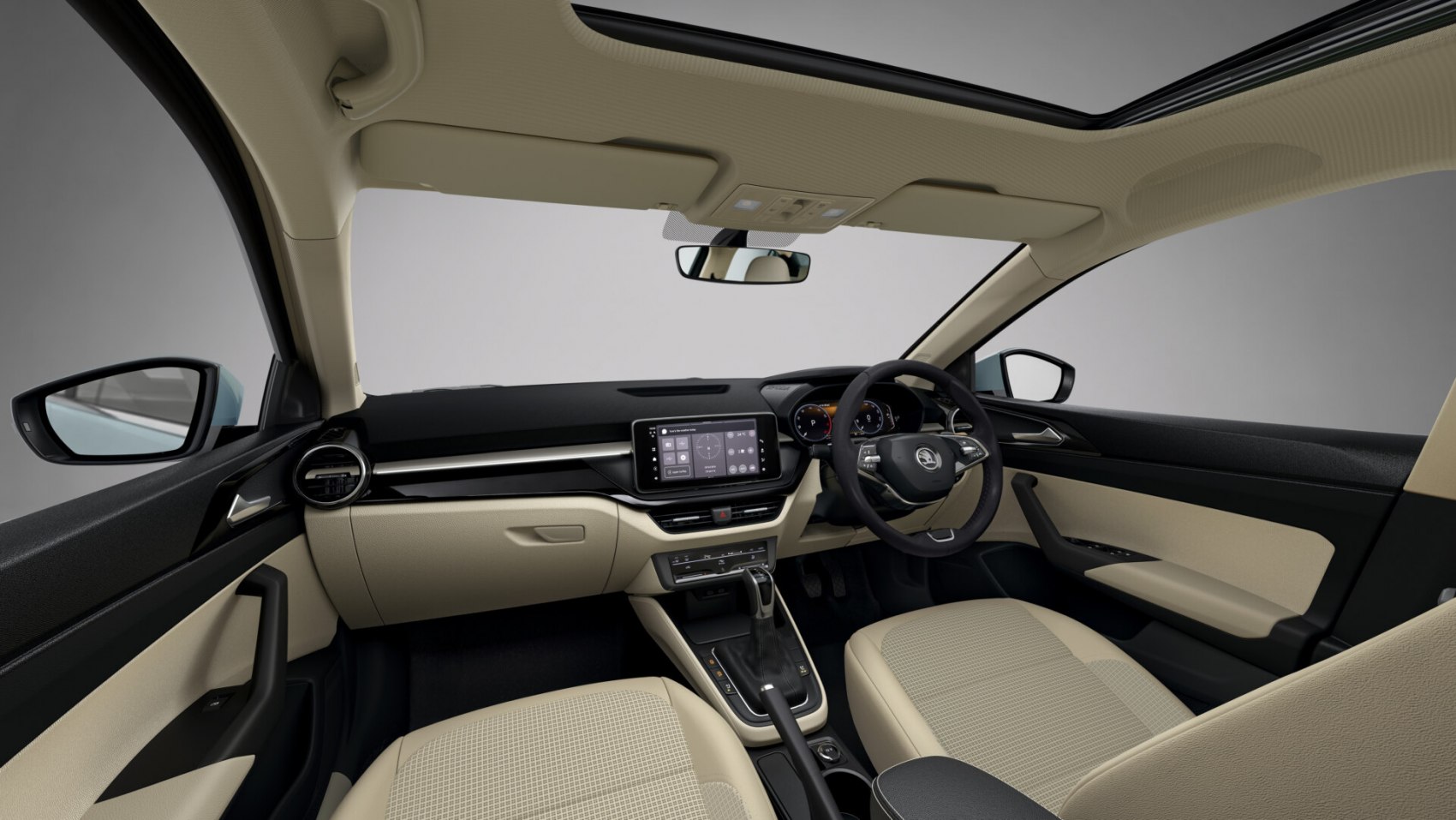 Beige and black car interior with touchscreen and digital dashboard