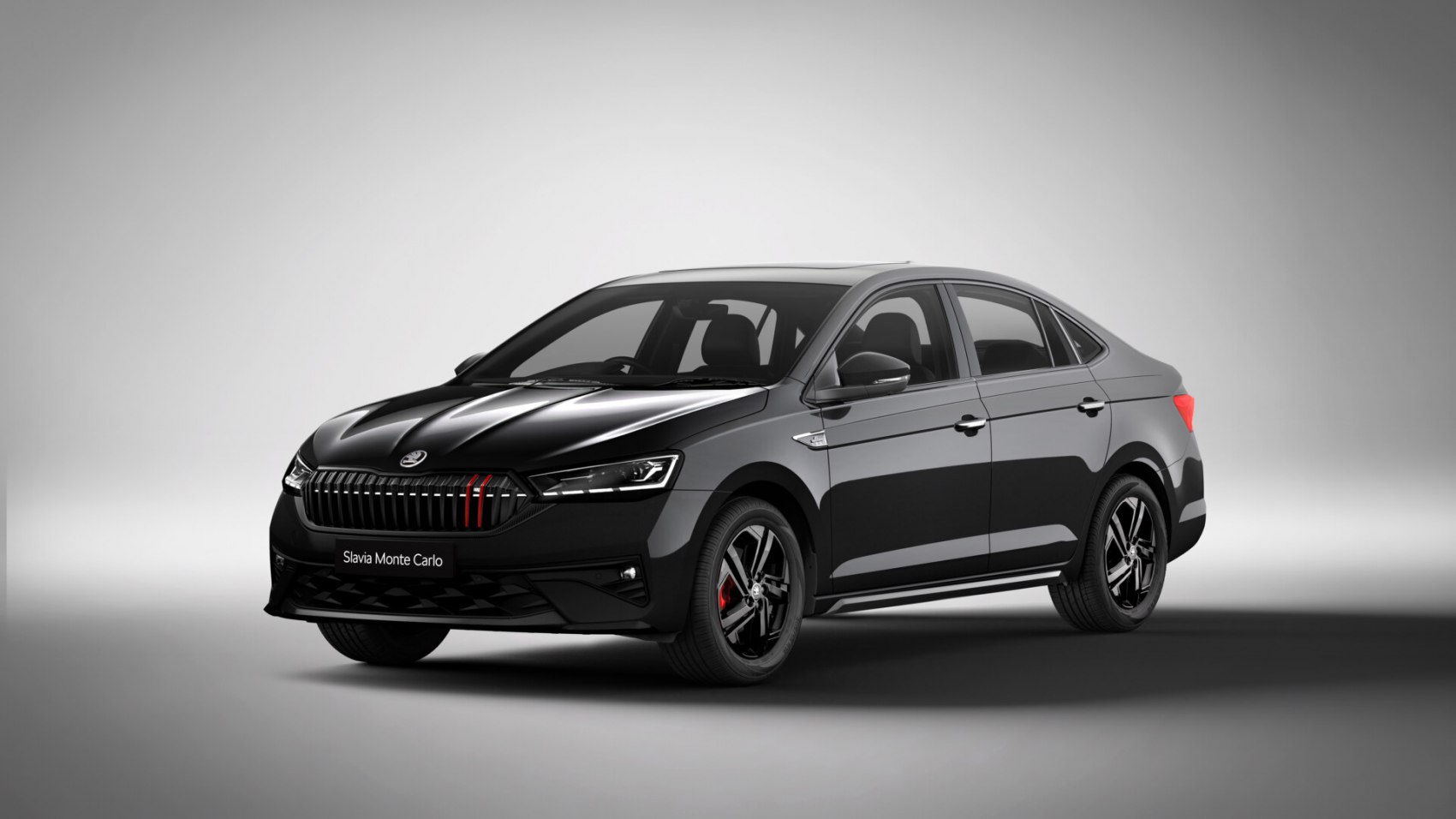 Sporty front grille and aerodynamic side profile of a black sedan