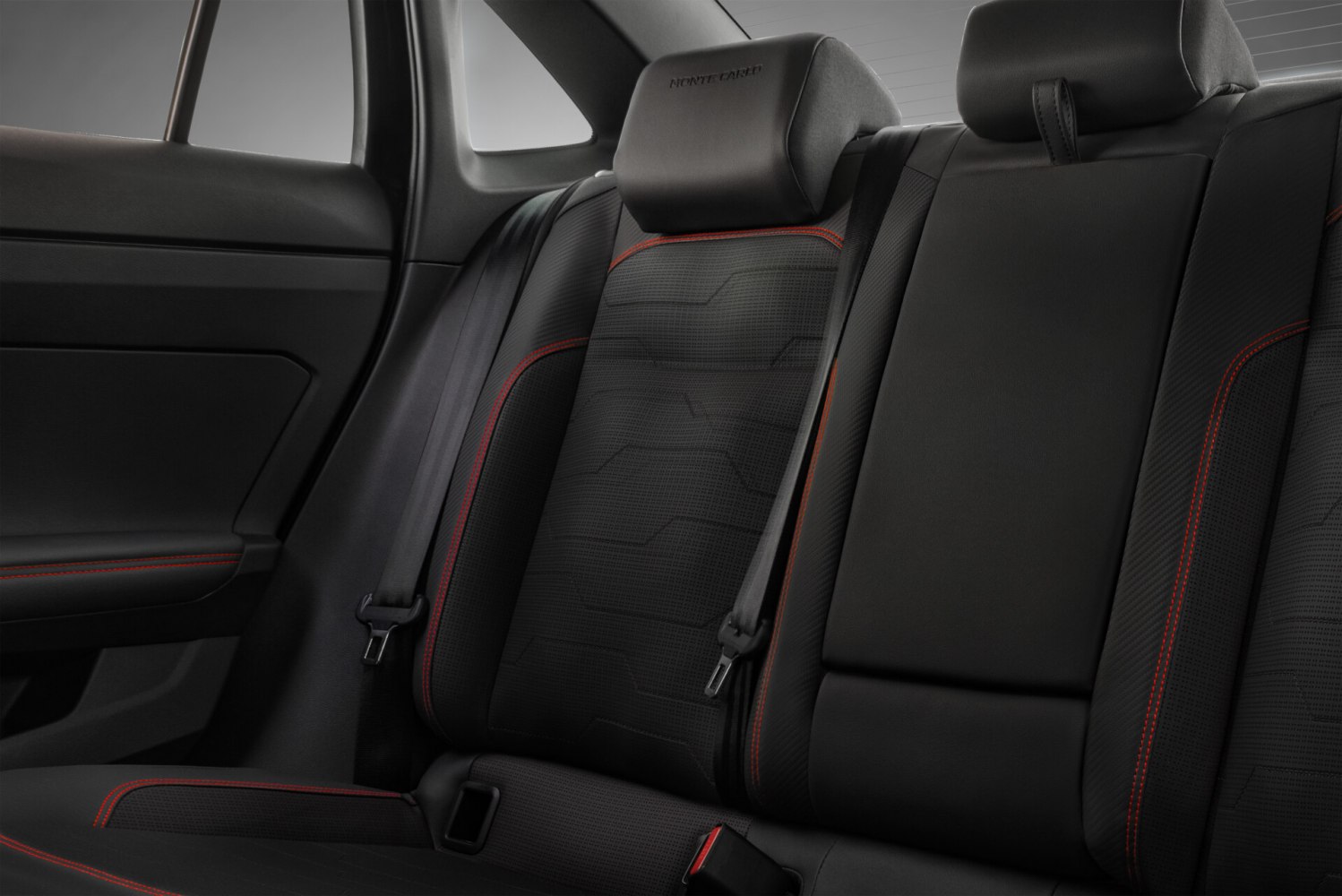 Rear seat interior with Monte Carlo upholstery and red stitching.