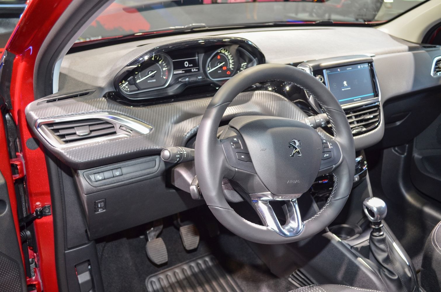 Dashboard with instrument cluster and steering wheel with logo